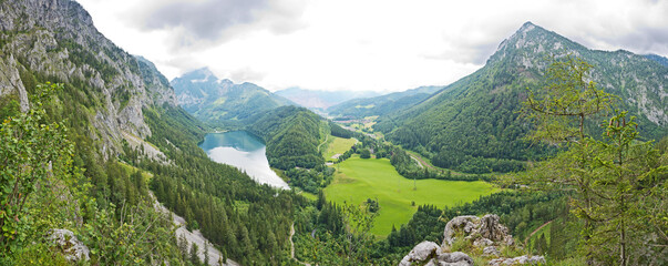 Panoramic view to Leopoldsteinersee mountain lake and Eisenerz with the Erzberg in beautiful alpine landscape.