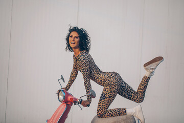 The young beautiful woman in a leopard dress. Sensual woman. Fashion photo. Model. 
