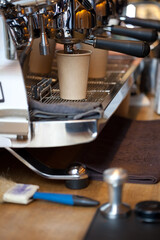 professional espresso machine Victoria Arduino White Eagle in coffee shop interior, blurred background