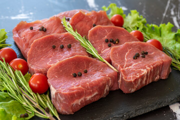 raw meat on a black background