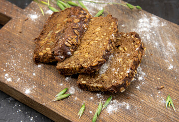 Fitness bread with seeds lies on a wooden Board.