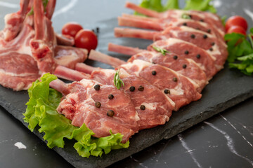 raw meat on a black background