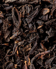 Close up of granules of black tea as a background.