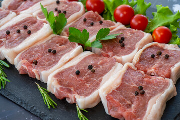 raw meat on a black background