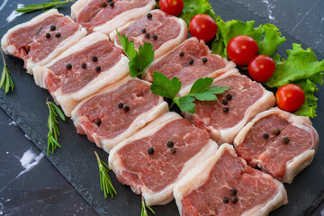 raw meat on a black background