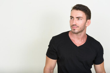 Portrait of handsome bearded man against white background