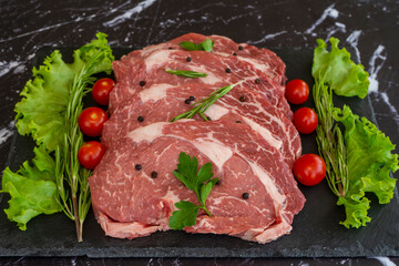 raw meat on a black background