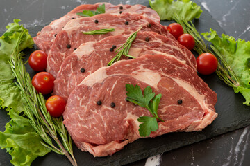 raw meat on a black background
