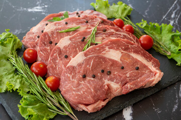 raw meat on a black background