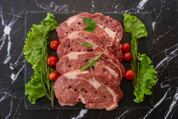 raw meat on a black background