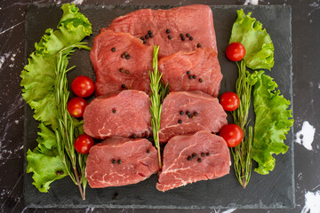 raw meat on a black background