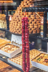 Showcase with traditional turkish delights, baklava, churchkhela