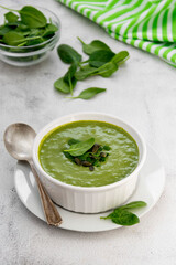 Creamy vegetable soup on bright table. Healthy detox food. Vegetarian food.