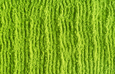 Matcha powder background. Green tea texture close up, selective focus