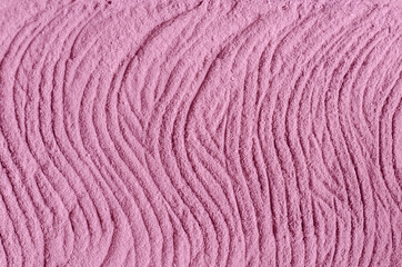 Pale pink cosmetic clay (alginate facial mask, body wrap) texture close up, selective focus. Abstract background with brush strokes.