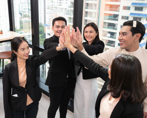 Group of diverse people multiethnic unity togetherness in the Volunteer community. Multi-ethnic corporate office business team winners join hands give high five together .