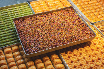 Baklava with pistachio in assortment on plates
