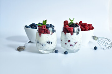 two glasses of delicious homemade smoothie, dessert made from chia and berries. delicious milkshake, vegan raw food. Healthy food and breakfast. Good morning.Selective focus