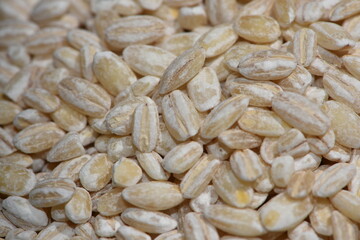 pearl barley. Organic pearl barley porridge is poured in bulk for the background.