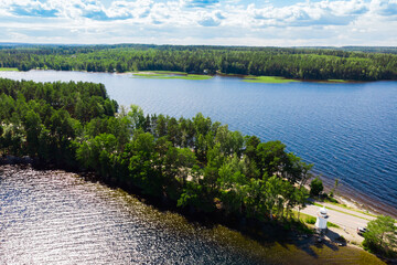 Aerial view of lighthouse on Pulkkilanharju Ridge at lake Paijanne, Paijanne National Park, Finland.