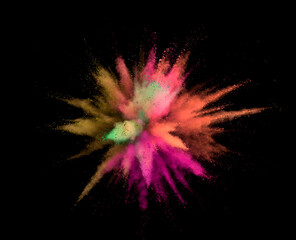 Abstract coloured powder explosion on black