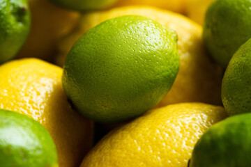 close up view of fresh ripe lemons and limes
