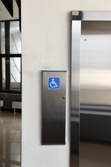 disabled signage, Modern steel elevator cabins in a business lobby or Hotel, Store, interior, office,perspective wide angle.