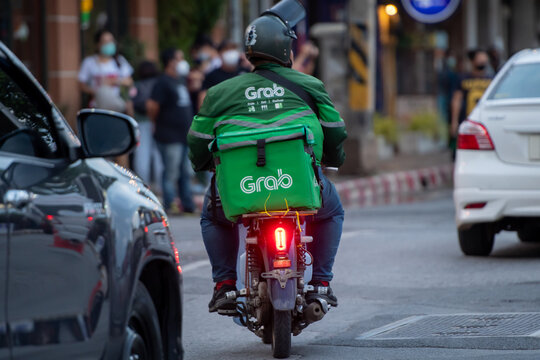 Nakhonratchasima, Thailand – July, 24: A man rides Grab food delivery motorbike on the city road.