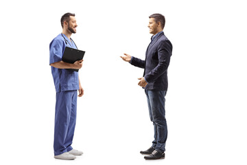 Male healthcare worker listening to a man talking