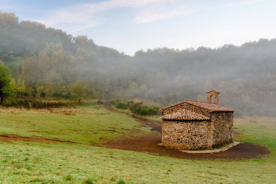 The Chapel of the Sta.Margarida Volcano, in the misty morning (Natural Park of Garrotxa, Catalonia, Spain) 