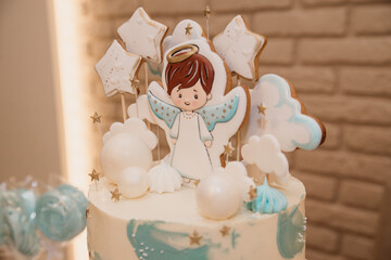 cake for the kids birthday party, little angel boy, children's pops in white chocolate and blue powder