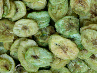 Green color banana chips with hot green chili flavor as texture