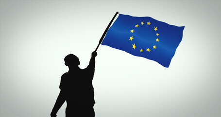 Black silhouette of a person waving the European Union flag