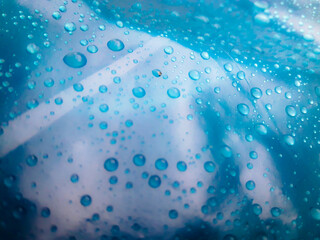 Water droplets on the blue background abstract texture
