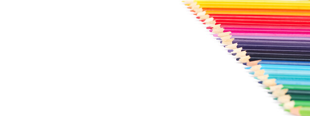 banner, multicolored pencils in a row by color temperature on a white background isolate, copy space