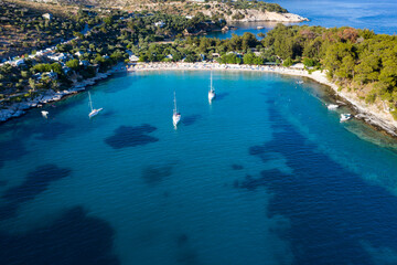 Obraz premium Sail boats in turquoise water in Thassos, Greece