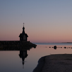Fototapeta premium A small chapel in the background of the sunset.