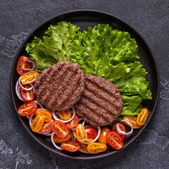 Fried cutlet for burger with vegetables.