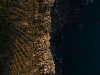 View of a cliff and the sea from drone in Cap de Creus, Spain