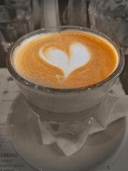 Cup of coffee latte art pattern heart shape