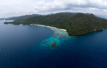 Drone view of a paradise beach in Raja Ampat, Papua, Indonesia