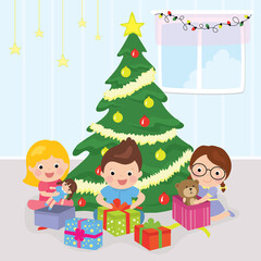 Obraz na płótnie Canvas Christmas tree with presents. Three cartoon happy children unpack gifts.