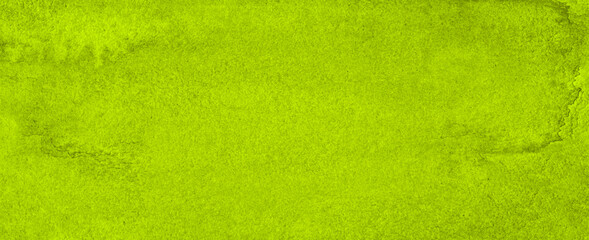 Vibrant green watercolor background with ragged strokes and uneven blurred paint. Abstract lime background for designs, layouts and patterns.