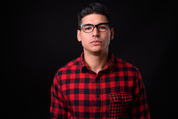 Portrait of young handsome hipster man with eyeglasses