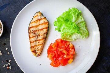 fried salmon grilled with vegetables salad tomato food background top view copy space eating healthy keto or paleo diet pescetarian