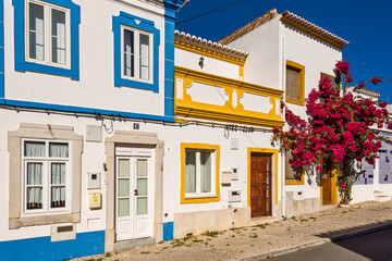 bougainvillea in front of a traditional Algarve house, in Tavira, Portugal