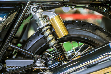 motorcycle shock absorbers with sub tank on top,  big bike.