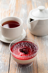 Cherry panna cotta in an Italian coffee, served in a plastic cup to go