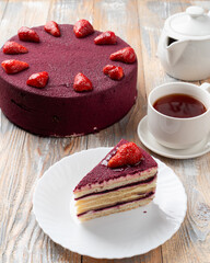 A slice of strawberry cake with velvet icing, menu photo