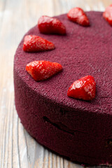 Italian sponge  strawberry cake, decorated with fresh berries, close up